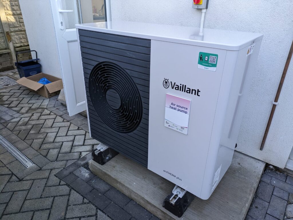 An air source heat pump unit installed outside a UK home